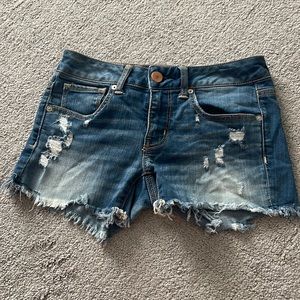 Distressed denim shorts